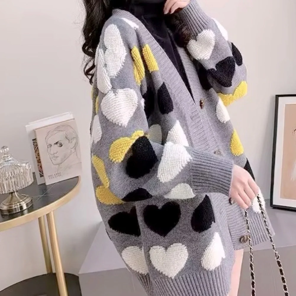 Gray button up cardigan sweater with plush heart pattern